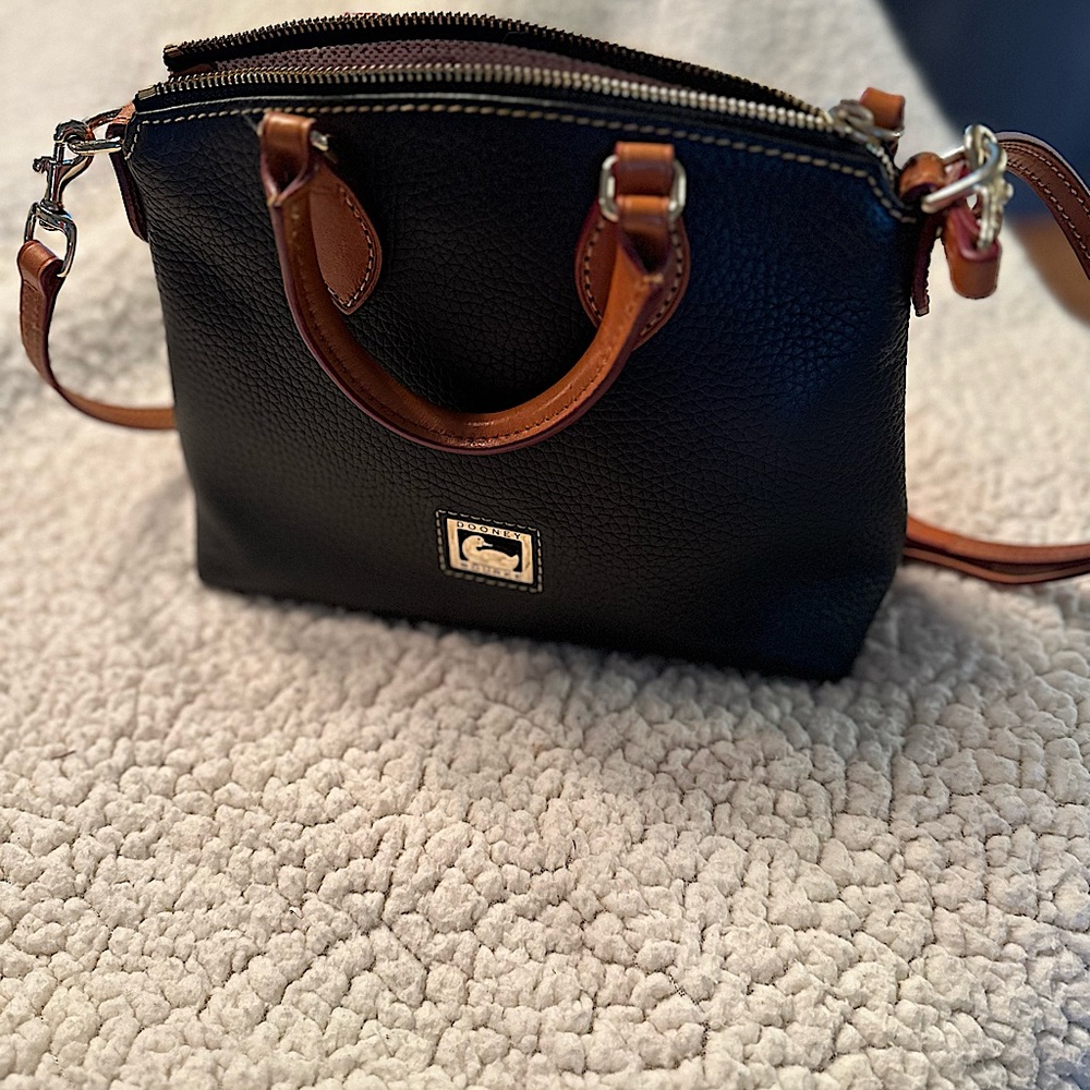 Dooney & Bourke Purse. Black leather with brown handles